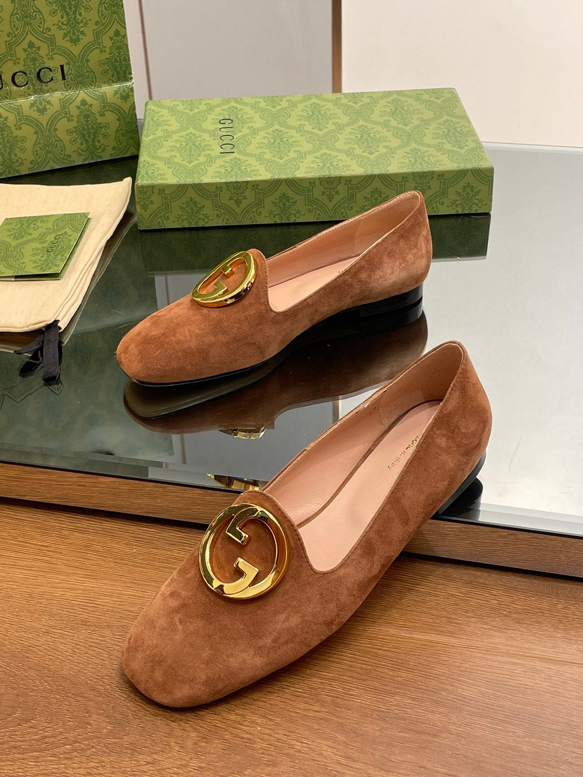 Blondie logo plaque loafers in bronze brown suede with gold hardware