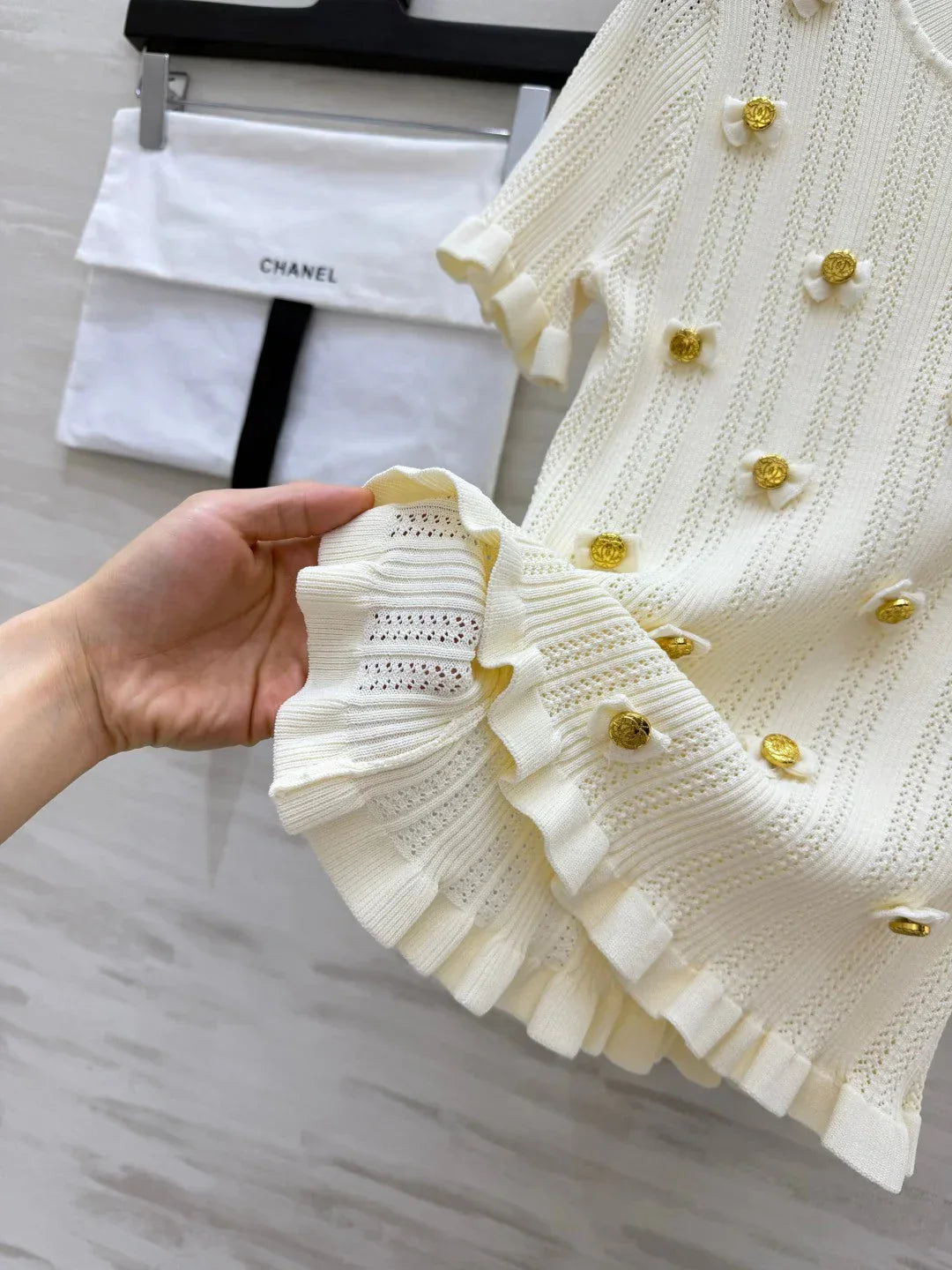 Chanel 2026 Gold Button Bow Short-sleeve Top Cream Cotton 394202